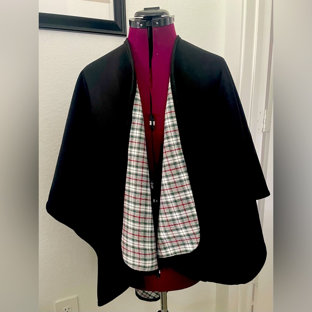One size fits all stylish ladies reversible poncho. Rain resistant.